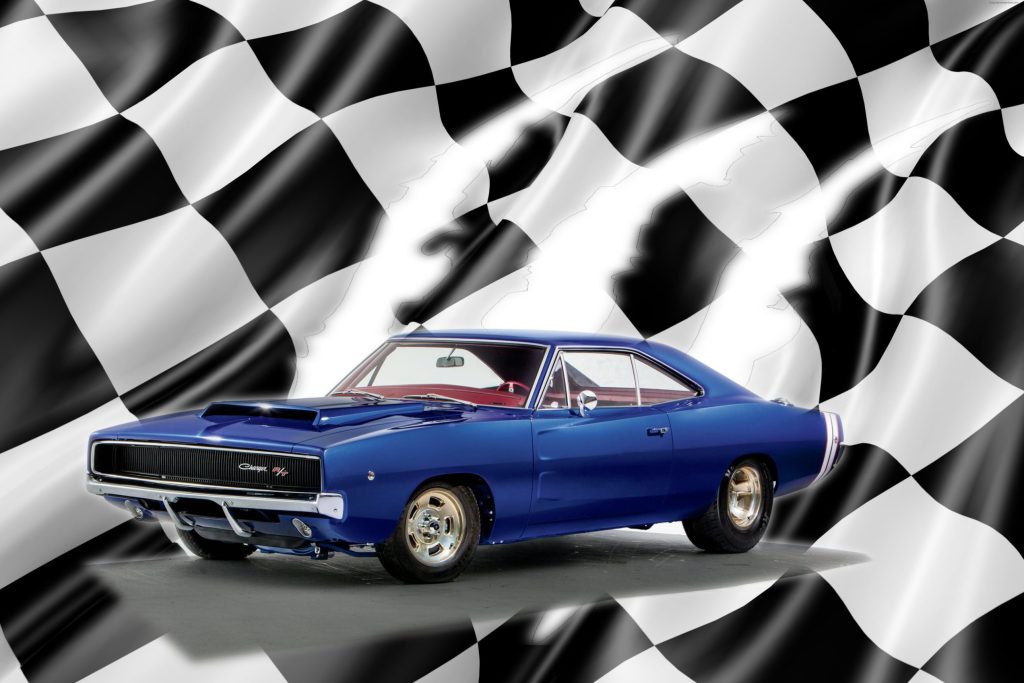 Blue 1968 Dodge Charger R/T muscle car on a checkered flag background.